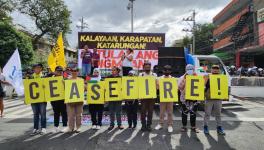 Workers in Manila, Philippines call for a ceasefire (Photo: Arnel PM)
