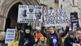 Supporters of Julian Assange rally outside the High Court on Day 1 of the hearing.