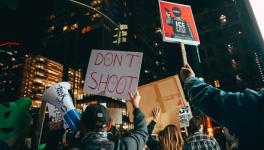 Anti-ICE signs during protest in San Diego. Photo: Micah Fong