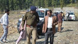 Team of administrative officials at the land which BJP claimed was to be used to built a Muslim University in Dholas village in Dehradun west.