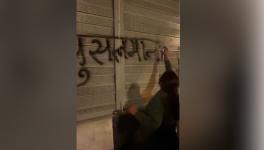 Women volunteers of Hindu Raksha dal writing anti-Muslim slogans on Dehradun-New Delhi highway.