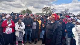 Members of Abahlali baseMjondolo protested outside the Rabbie Ridge Hall after the PIE Amendment Bill Public Hearing was postponed without any announcement to the public from the Human Settlements Department. Photo: AbM/FB