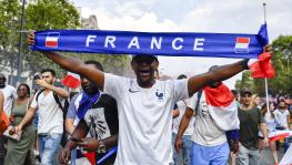 French football fan at Champs-Élysées in Paris