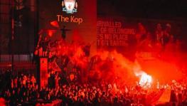Liverpool fans celebrate the English football club's Premier League title victory at Anfield