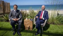 French President Emmanuel Macron (L) and US President Joe Biden enjoy a light moment at the G7, Cornwall, UK, June 12, 2021