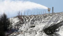 Snow machines are working overtime at Beijing skiing venues with no natural snow