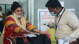 Chennai, June 03 (ANI): Health workers inspect passengers arriving from high risk countries for MonkeyPox symptoms, at Chennai International Airport, on Friday.