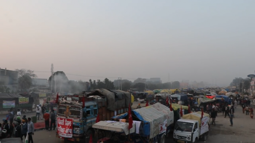 Screenshot of a video showing rows of trucks and trolleys at Singhu border. VIdeo shot by Ronak Chhabra
