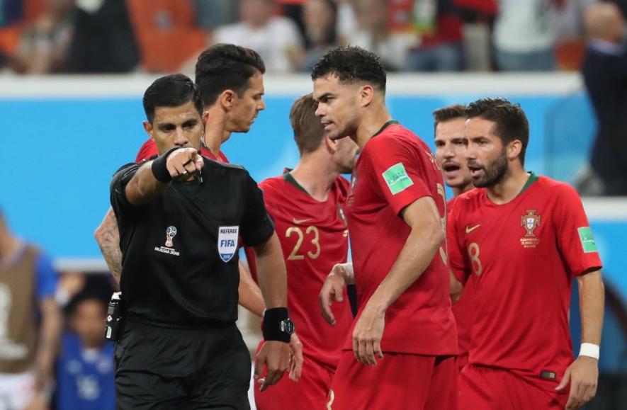 VAR penalty decision during Iran vs Portugal FIFA World Cup match.