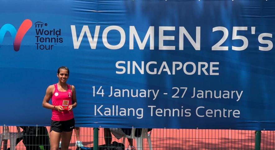Ankita Raina with the ITF Singapore Open tennis tournament trophy