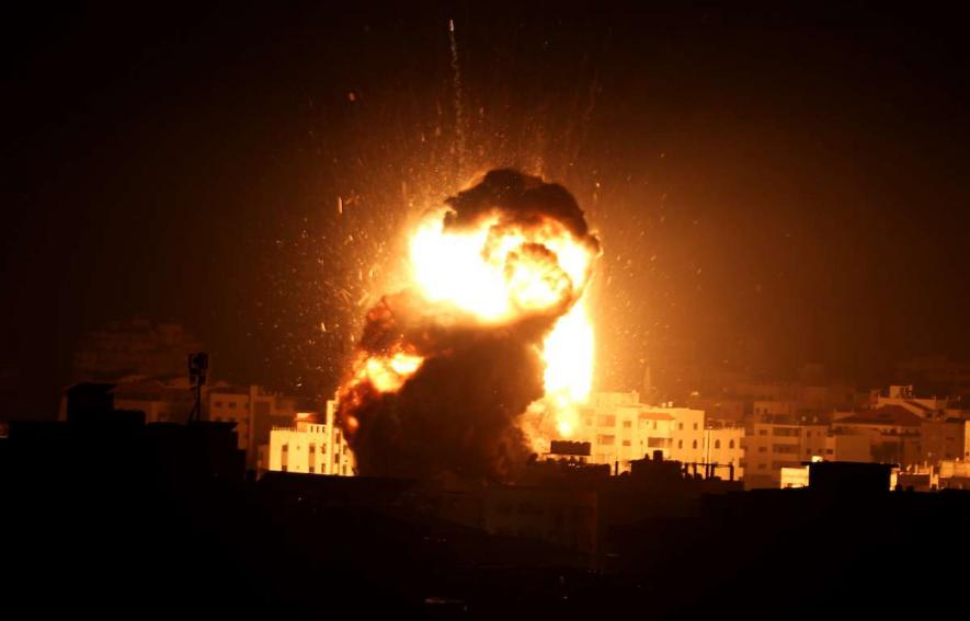 A ball of fire is seen, following an Israeli airstrike on Gaza, on a building believed to house the offices of Hamas chief, Ismail Haniyeh.