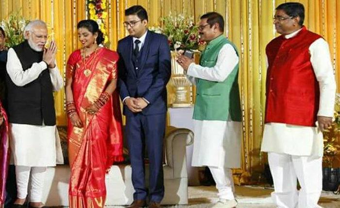 Surendra Rai (in red short coat) shares stage with PM Narendra Modi in a marriage function