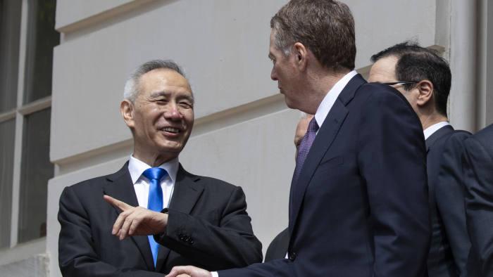 Liu He, China's vice premier, left, shakes hands with Robert Lighthizer, right, on leaving the US trade representative's office on Friday following the latest round of trade talks