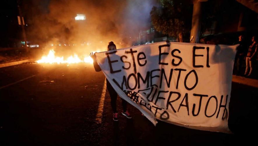Photo from one of the road blockades in Tegucigalpa, the banner reads: "This is the moment, OUT JOH" 