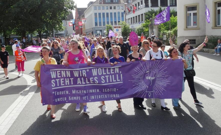 Sea of Purple: With Prams and Whistles, Swiss Women Strike for Equal Pay