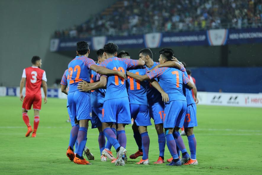 Indian football team players celebrate a goal against Tajikistan in intercontinental Cup