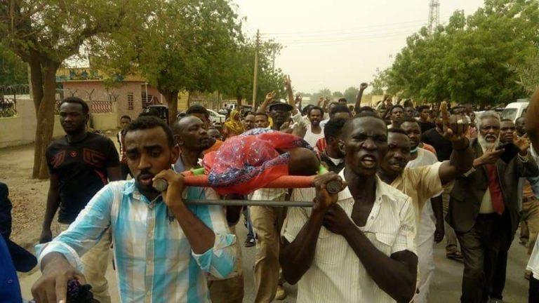 Protesters carry those killed during the protests in Atbara, River Nile State. 