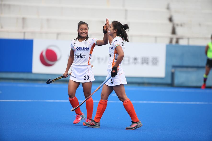 Indian women's hockey team players Lalremsiami and Monika celebrate a goal against Japan in the Olympic test event in Tokyo