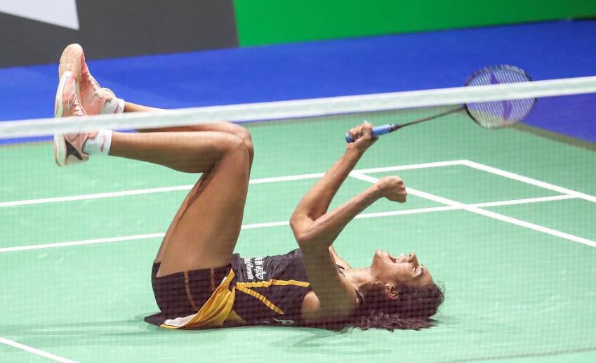 PV Sindhu celebrates after beating Nozomi Okuhara to win gold at the BWF Badminton World Championships in Basel