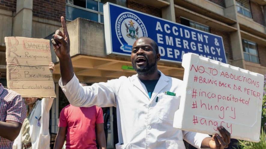 Doctors protest outside Parirenyatwa hospital in Harare on Sunday,