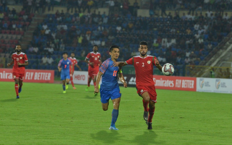 Indian football team´s Sunil Chhetri and Oman´s Mohammed al Musallami vie for the ball in their FIFA World Cup qualifying match