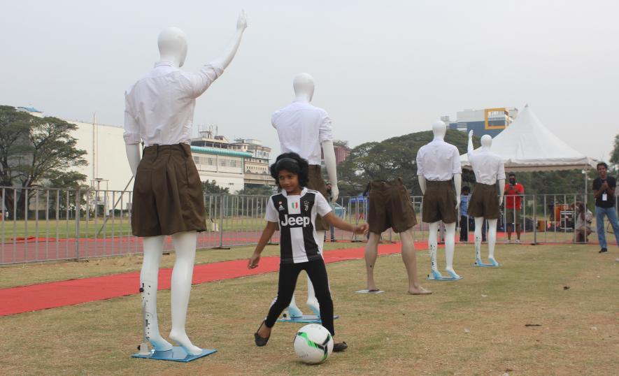 Dribbling past Fascist defenders at football against Fascism event in Kochi.
