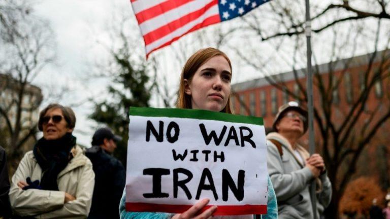 A protester holds an anti-war sign in the US. (Photo: Getty Images)