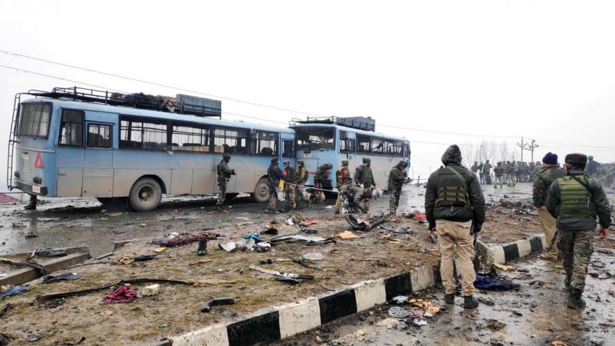Pulwama: Indian soldiers examine the debris after an explosion in Lethpora in south Kashmir's Pulwama district February 14, 2019.  Image Courtesy: Reuters