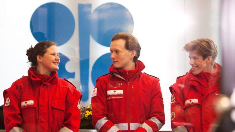 Red Cross medics waiting to check the temperature of participants at the OPEC+ meeting in Vienna, March 6, 2020 for coronavirus. None was found infected, but the meeting ended in disharmony.   