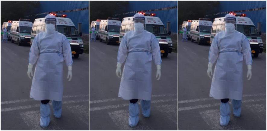 An ambulance worker in PPE kit in Delhi