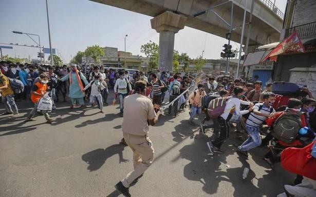 Migrant workers and police clash in Ahmedabad