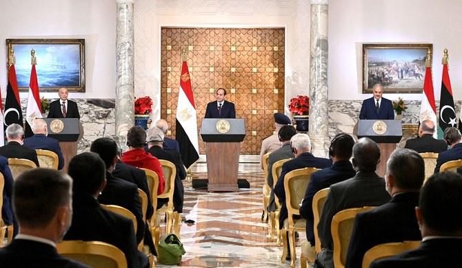 Egyptian President Abdel Fattah al-Sisi (C), flanked by Libyan commander Khalifa Haftar (R) and the Libyan Parliament speaker Aguila Saleh (L) announced a road map to end the fighting in Libya, Cairo, June 6, 2020