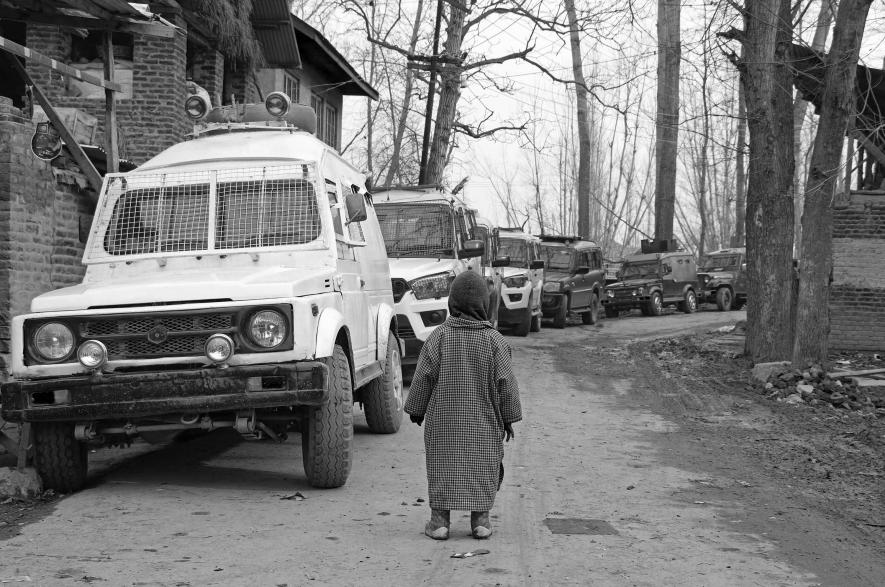 (A boy looks at armed forces’ vehicles during a counter-insurgency operation in Tral area of Pulwama in South Kashmir on June 25, 2020). Picture: Kamran Yousuf/NewsClick