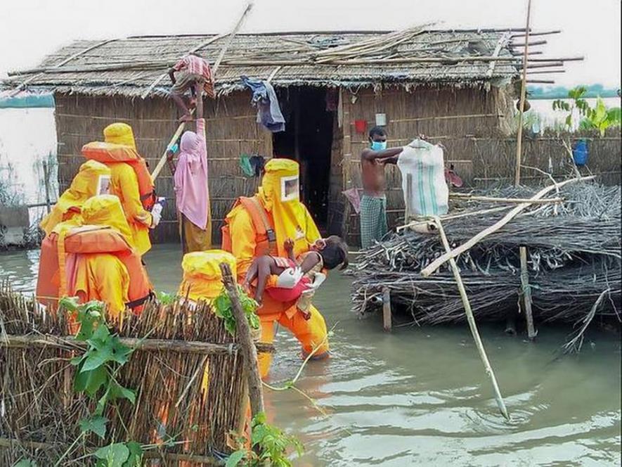 NDRF personnel in action in Assam’s Dhubri district. Photo Courtesy: Twitter/@NDRFHQ/PTI