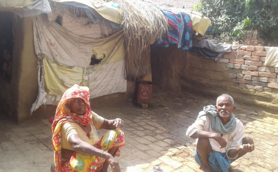Darogi Manjhi and his wife Phulwa Devi in their mud -thatched house