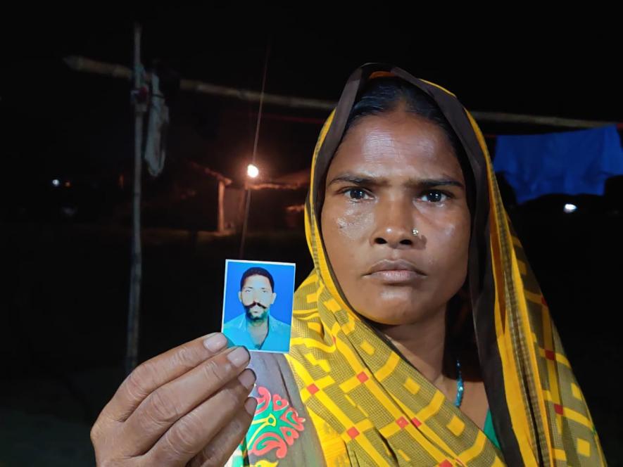 Rekha Devi, showing picture of her dead husband whose life was claimed by illicit liquor on January 1,2020