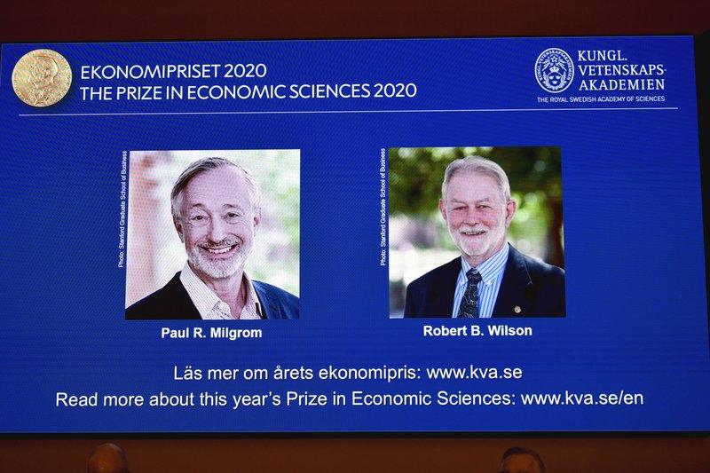 Winners of the Sveriges Riksbank Prize in Economic Sciences in Memory of Alfred Nobel for 2020 at a press conference in Stockholm, Monday Oct. 12, 2020. Americans Paul R. Milgrom, left, and Robert B. Wilson have won the Nobel Prize in economics for "improvements to auction theory and inventions of new auction formats.