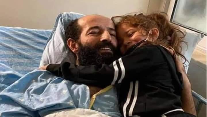 Maher al-Akhras with his daughter.