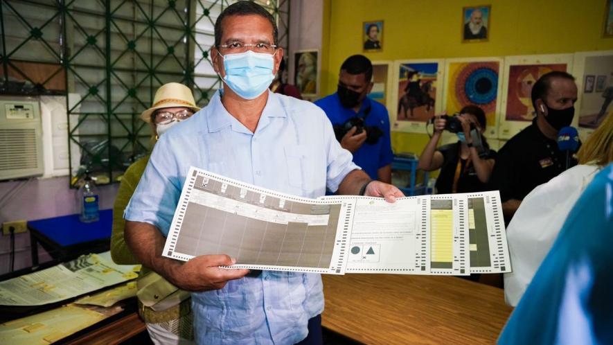 Pedro Pierluisi of the right-wing New Progressive Party (PNP) casts his vote. He is leading the gubernatorial race in Puerto Rico with a narrow margin of less than 1% of the votes with 91% of the votes counted. Photo: Pedro Pierluisi twitter