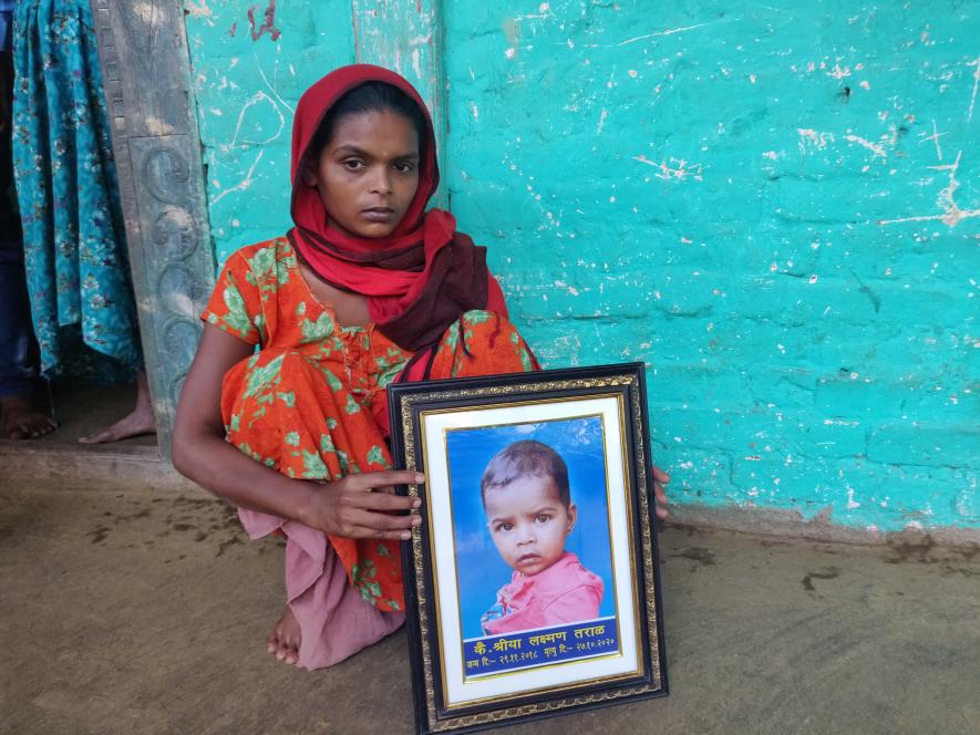 Mangala Taral holds newly framed photo of her daughter Shreya who recently died