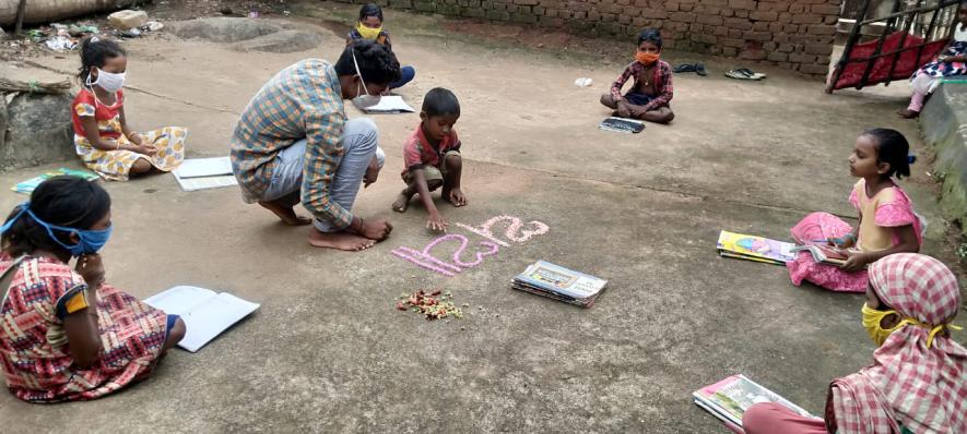 Village Volunteer conducting home-based classes in the village