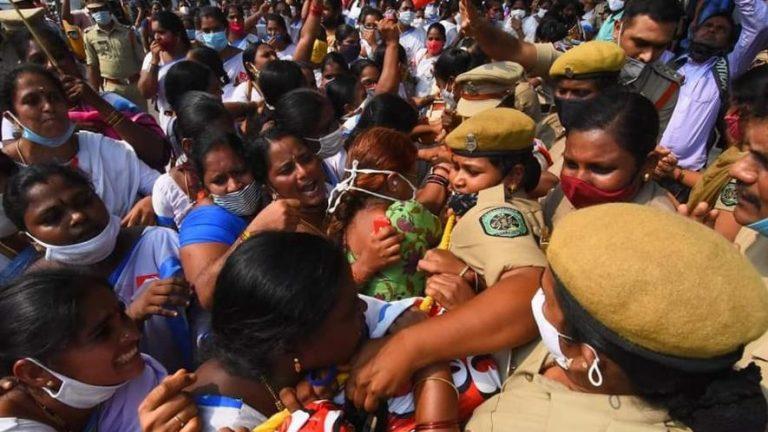 Police repress protest by community health workers in India.