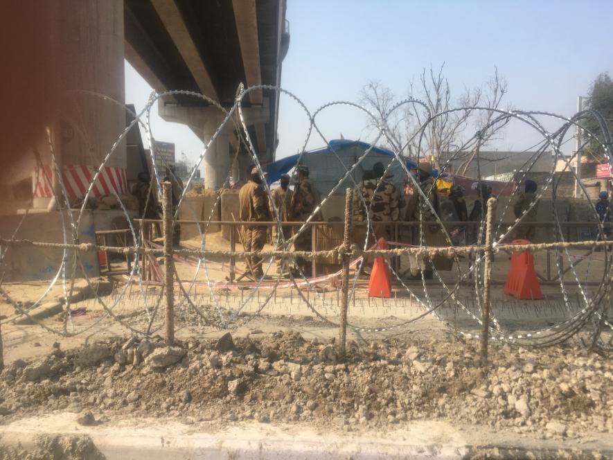 Police barricade at Tikri border protest site