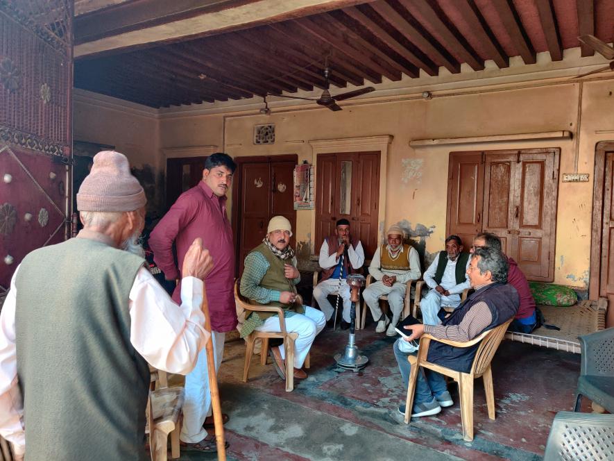 Muslim community members talkin to extend More Support to Rakesh Tikait in Jaula village