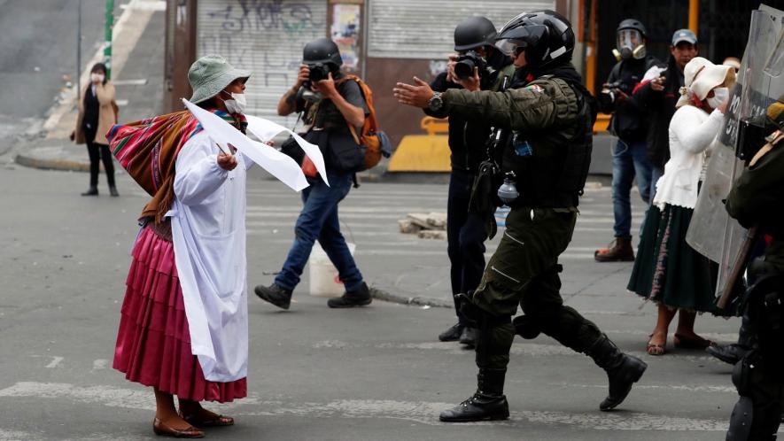 Indigenous woman marches against the coup in Bolivia. Photo: Redfish