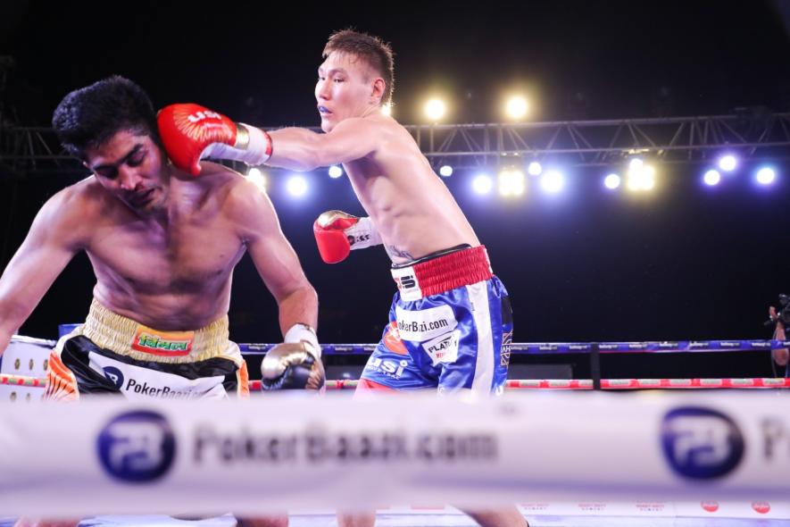 Artysh Lopsan knocks down Vijender Singh