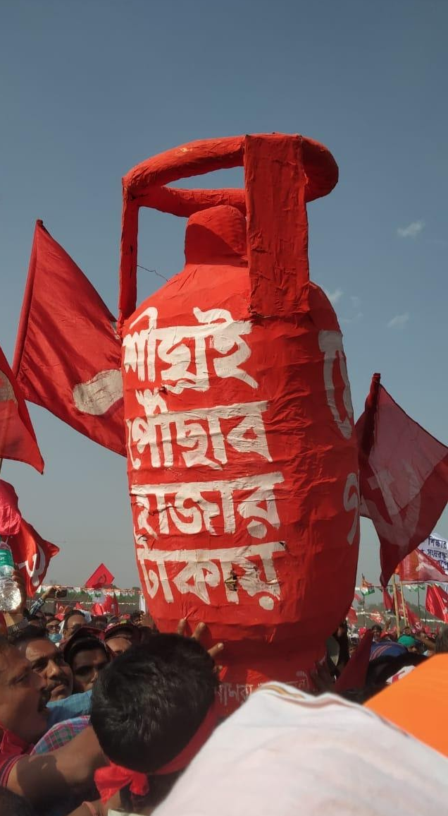 A group of Left supporters hold an LPG cylinder shaped structure at the Brigade Rally. Credit: Abhijit Datta