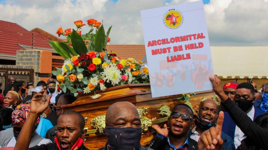 26 February 2021: Thami Molefe’s colleagues carry his coffin through the streets. Molefe was one of three ArcelorMittal employees who died recently at the company’s Vanderbijlpark plant. (Photographs by Magnificent Mndebele)