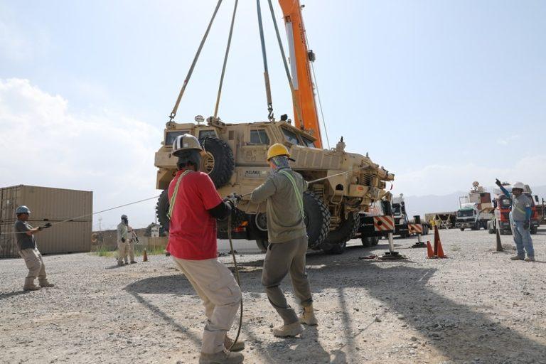 A Mine Resistant Ambush Protected vehicle being loaded on to a flatbed trailer, Bagram Air Field, Afghanistan. (File photo)
