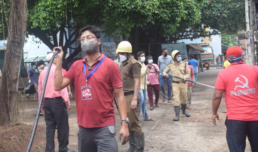 Red volunteers santization work at Baharampur. Image Credit : Anirban